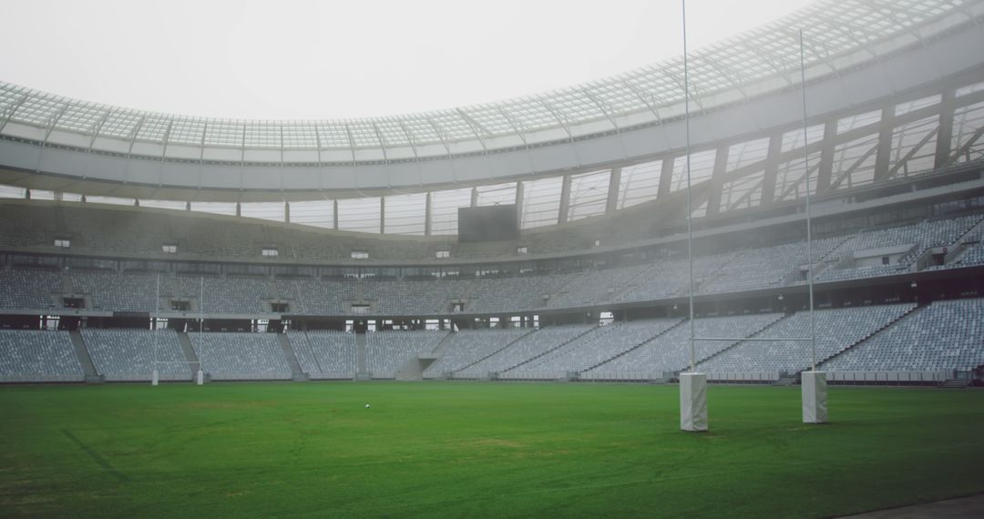 Empty Stadium with Green Field on Foggy Day - Free Images, Stock Photos and Pictures on Pikwizard.com