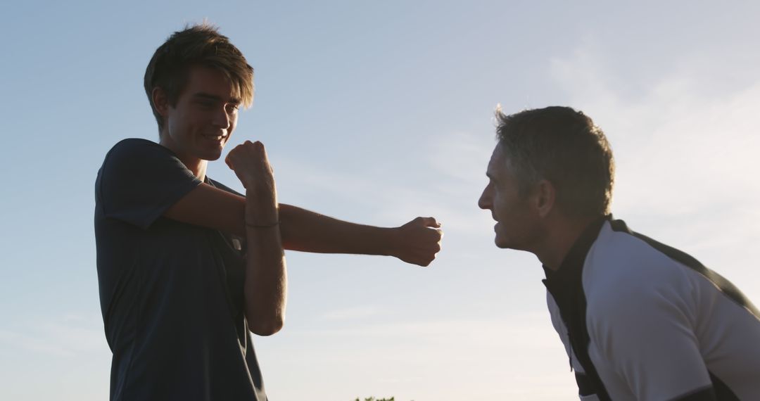 Father and Son Exercising Together Outdoors - Free Images, Stock Photos and Pictures on Pikwizard.com