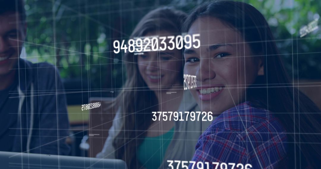 Young team collaborating with floating code and data overlays on laptop in modern workspace