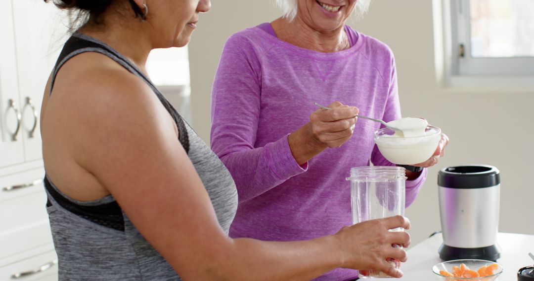 Senior Women Preparing Healthy Smoothie Together in Kitchen - Free Images, Stock Photos and Pictures on Pikwizard.com