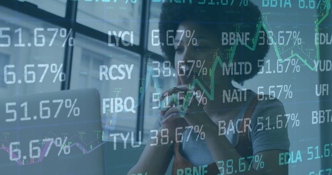 Woman Analyzing Financial Data with Graph Overlays on Laptop Screen