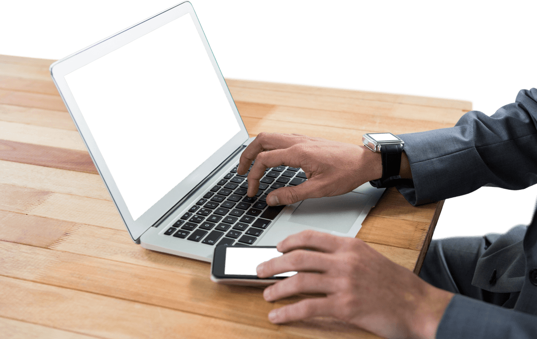 Businessman Typing on Laptop Next to Smartphone on Transparent Background