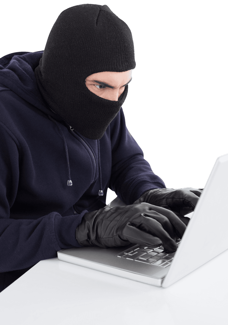 Hacker in Balaclava Focusing on Cybersecurity Breach with Laptop, Gloved Hands