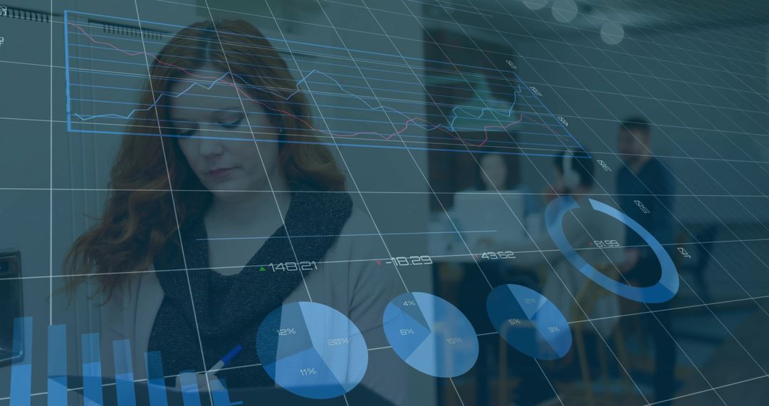 Businesswoman Analyzing Data in Collaborative Office Meeting