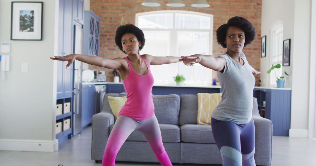 Mother and Daughter Practicing Yoga in Living Room - Free Images, Stock Photos and Pictures on Pikwizard.com