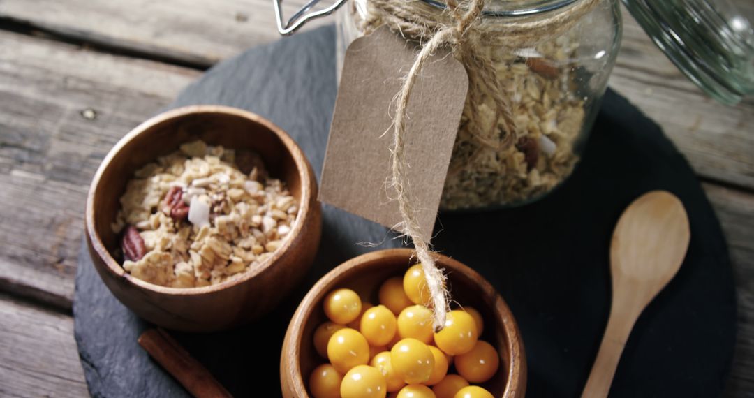 Rustic Breakfast Setup with Granola and Golden Berries - Free Images, Stock Photos and Pictures on Pikwizard.com