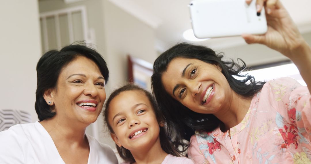 Three Generations of Women Smiling While Taking a Selfie Together - Free Images, Stock Photos and Pictures on Pikwizard.com