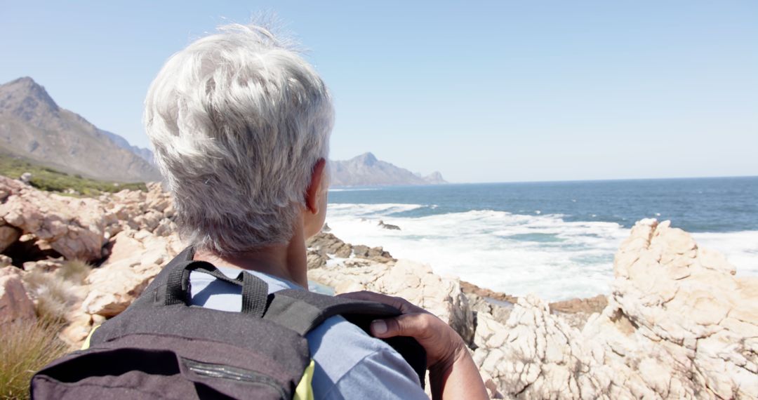 Senior Woman Enjoying Coastal Adventure Lives Actively in Retirement