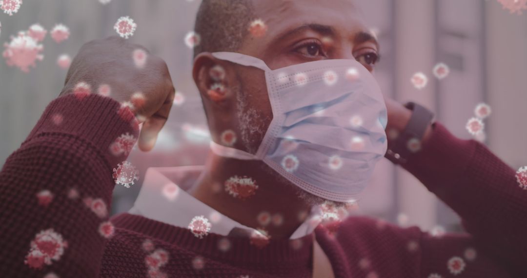 Man Wearing Mask Amidst Floating COVID-19 Particles Conceptual Image