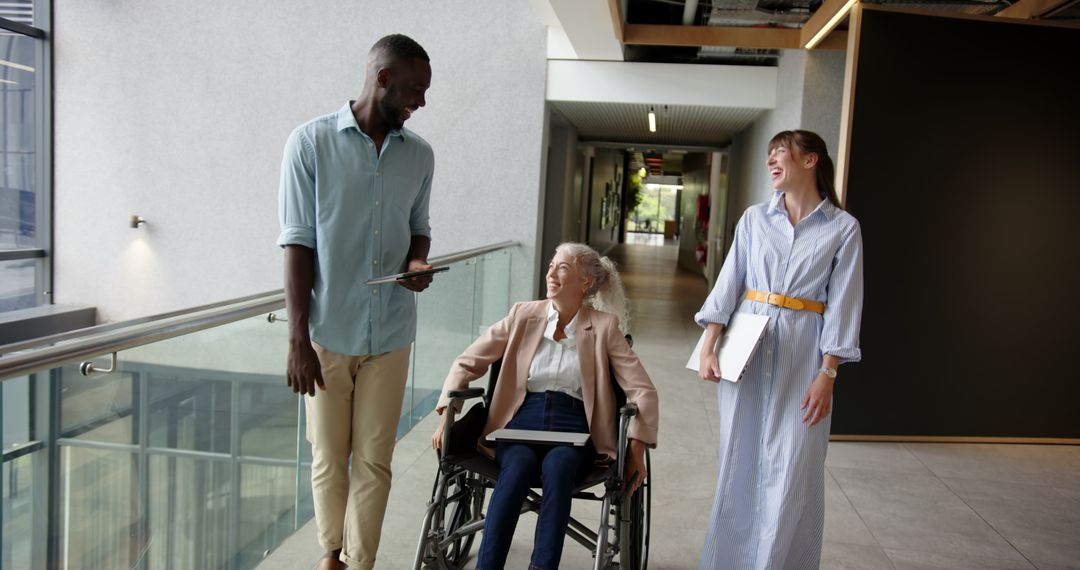 Diverse Professional Colleagues in Office Environment Engaging in Discussion