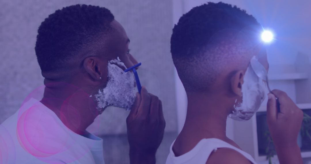 Father and Son Enjoying Shaving Routine Together
