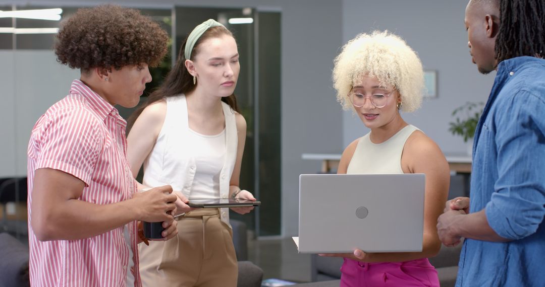 Team Collaboration with Technology in Modern Office Setting