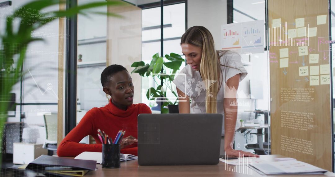 Colleagues Collaborating Over Business Data in Modern Office Setting