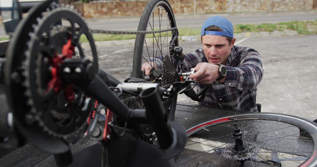 Male Cyclist Repairing Bicycle on Roadside - Free Images, Stock Photos and Pictures on Pikwizard.com