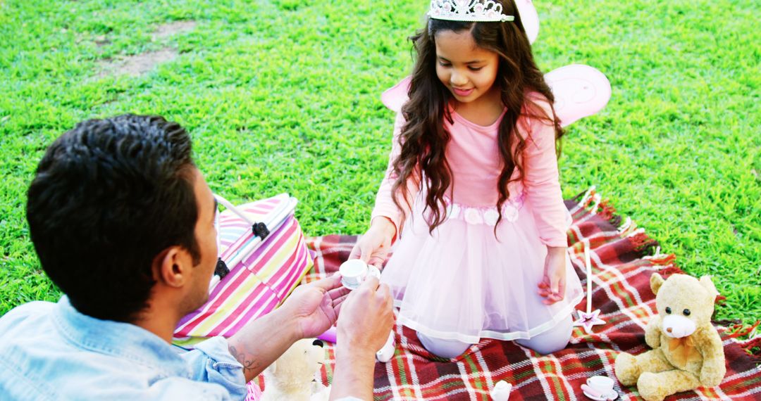 Father and Daughter Enjoying Toy Tea Party Outdoors - Free Images, Stock Photos and Pictures on Pikwizard.com