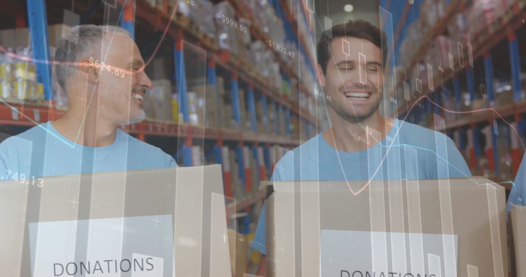 Smiling Volunteers Handling Donation Boxes in Warehouse Setting