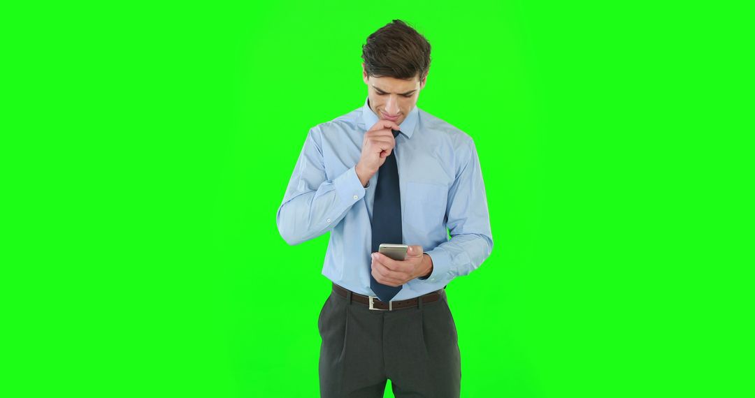 Businessman in Blue Shirt Working on Smartphone with Green Chromakey Background - Free Images, Stock Photos and Pictures on Pikwizard.com