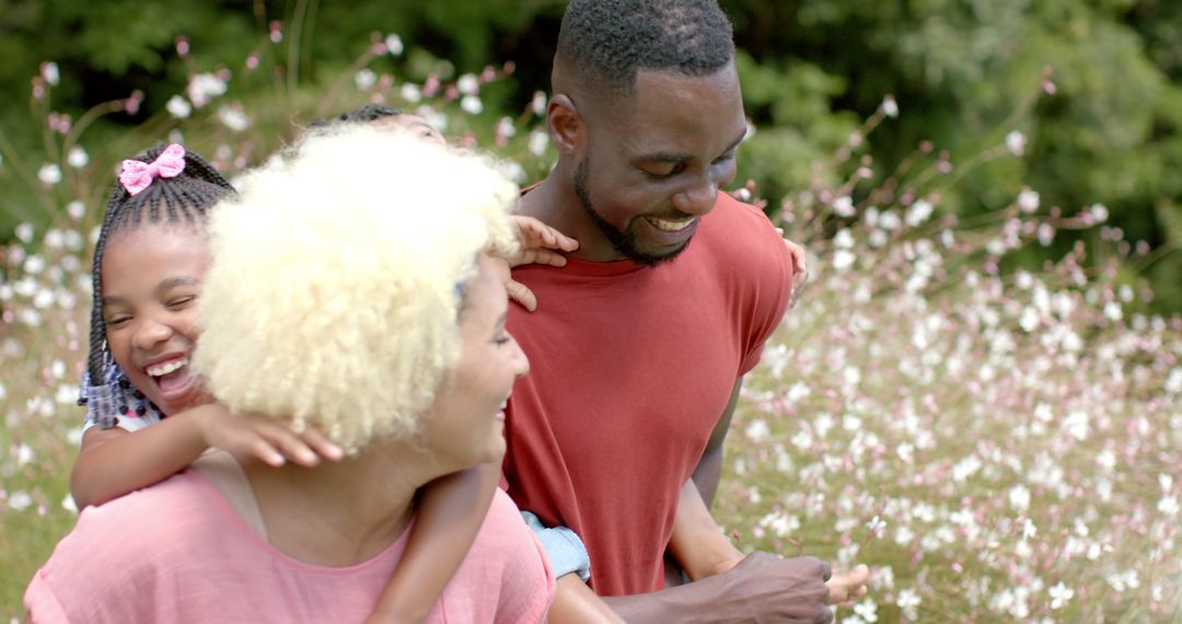 Joyful Family Enjoying Time Together in Flower Field