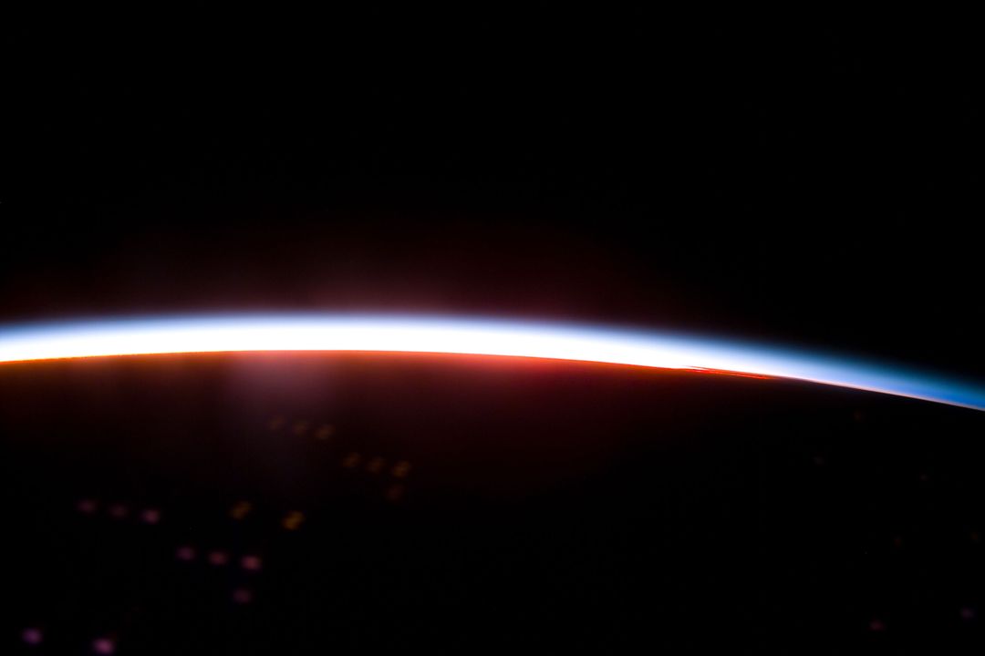 The Earth limb glows shortly after an orbital sunrise - Free Images, Stock Photos and Pictures on Pikwizard.com