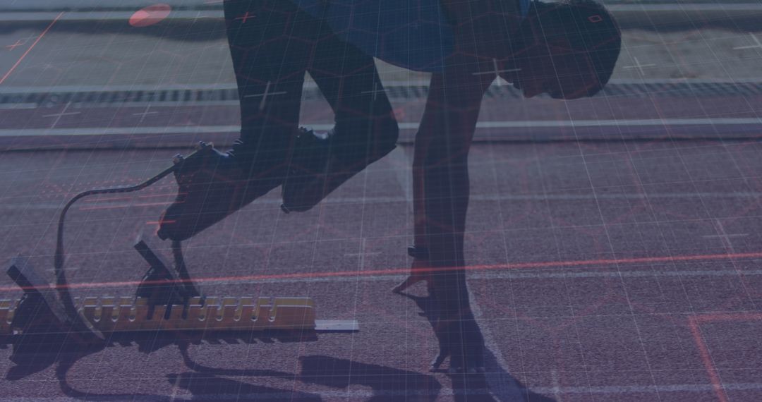 Adaptive Athlete with Blades Ready at Starting Block on Track