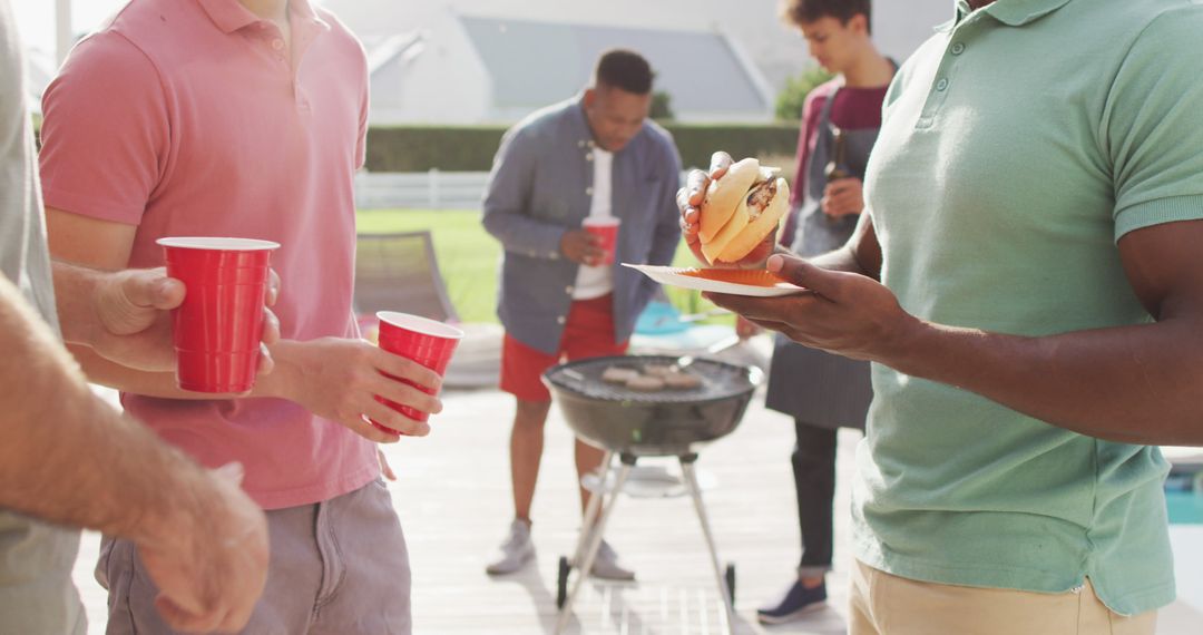 Group of Multiethnic Friends Enjoying Backyard BBQ Party - Free Images, Stock Photos and Pictures on Pikwizard.com