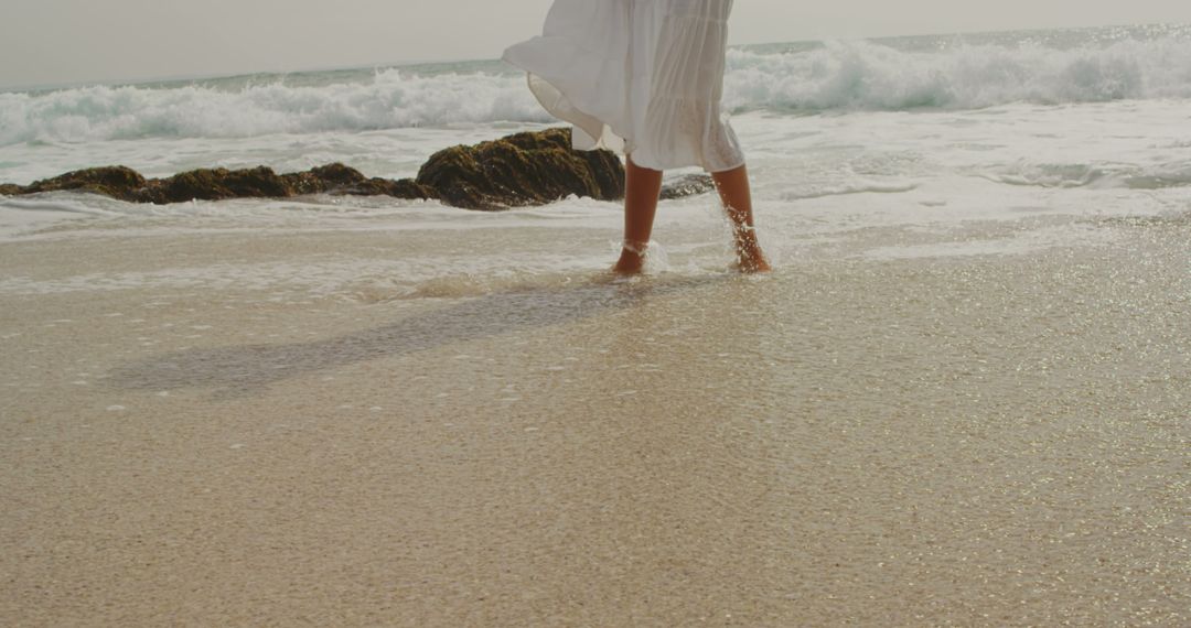 Serene Woman Strolling Pristine Beach in Elegance