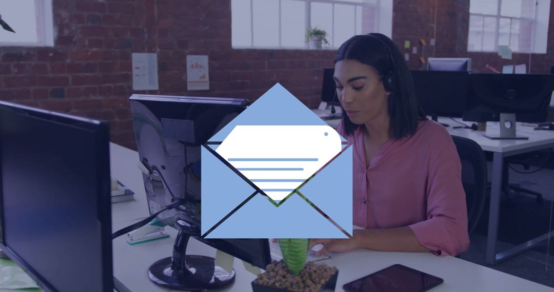 Support Agent Typing at Desk with Headset in Modern Office