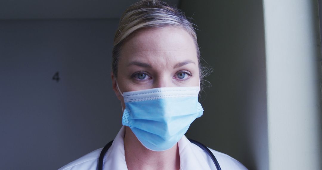 Portrait of caucasian female doctor wearing face mask at hospital - Free Images, Stock Photos and Pictures on Pikwizard.com