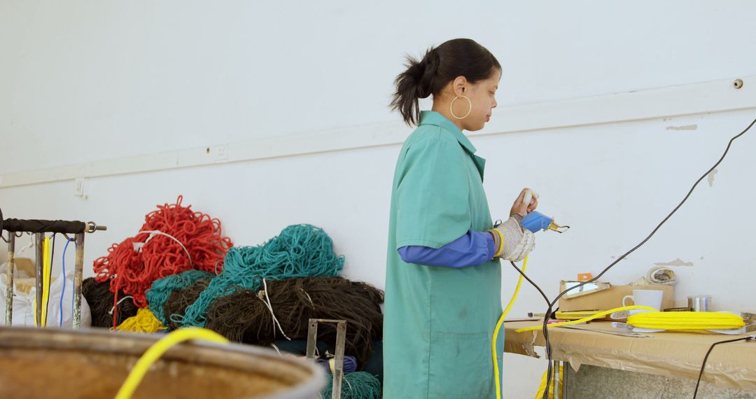 Asian Woman Conducting Detailed Industrial Research in Workspace - Free Images, Stock Photos and Pictures on Pikwizard.com