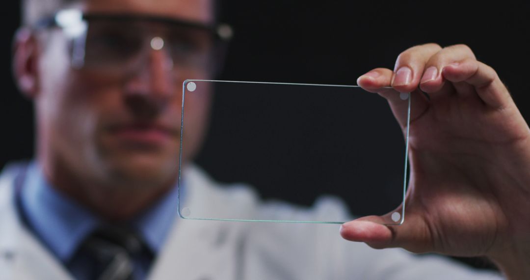 Scientist Examining Transparent Glass Plate - Free Images, Stock Photos and Pictures on Pikwizard.com