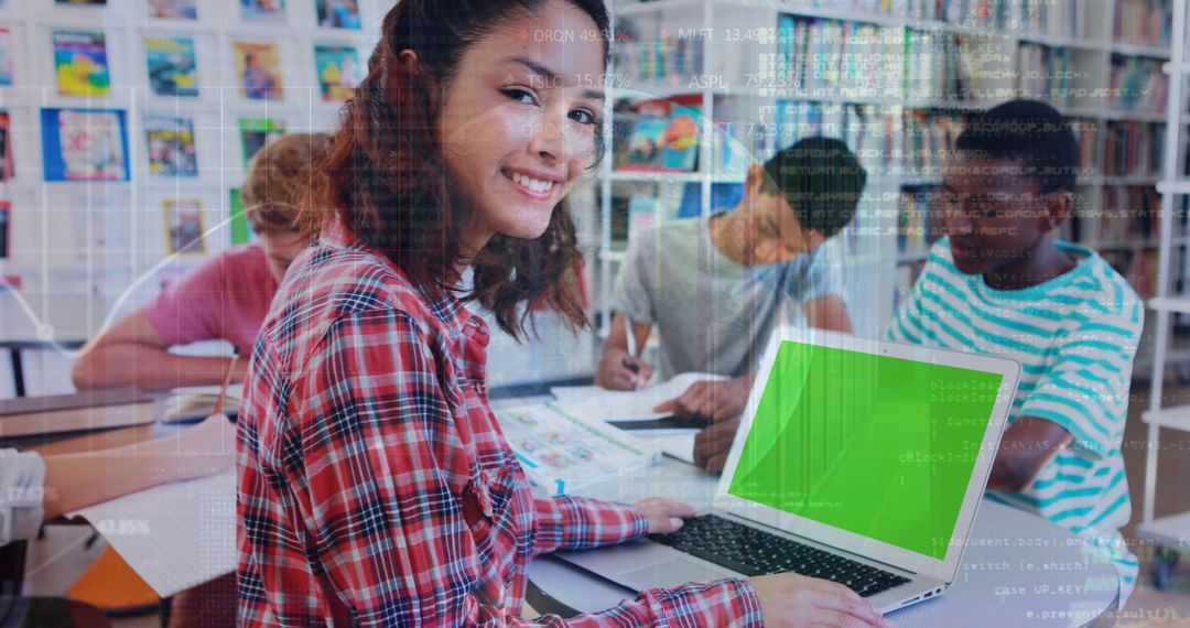 Happy Student Studying at School with Graph Overlay and Laptop
