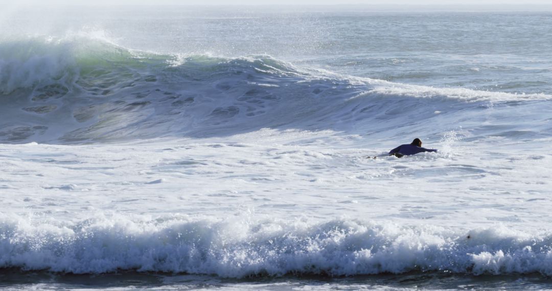 Lone Surfer Navigating Challenging Ocean Waves - Free Images, Stock Photos and Pictures on Pikwizard.com