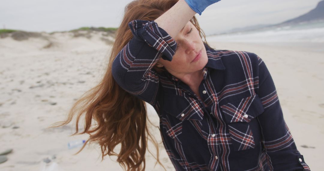 Woman Cleaning Beach Looking tired - Free Images, Stock Photos and Pictures on Pikwizard.com