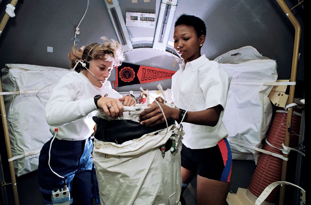 Female Astronauts Working in Space Shuttle, Preparing Scientific Equipment - Free Images, Stock Photos and Pictures on Pikwizard.com