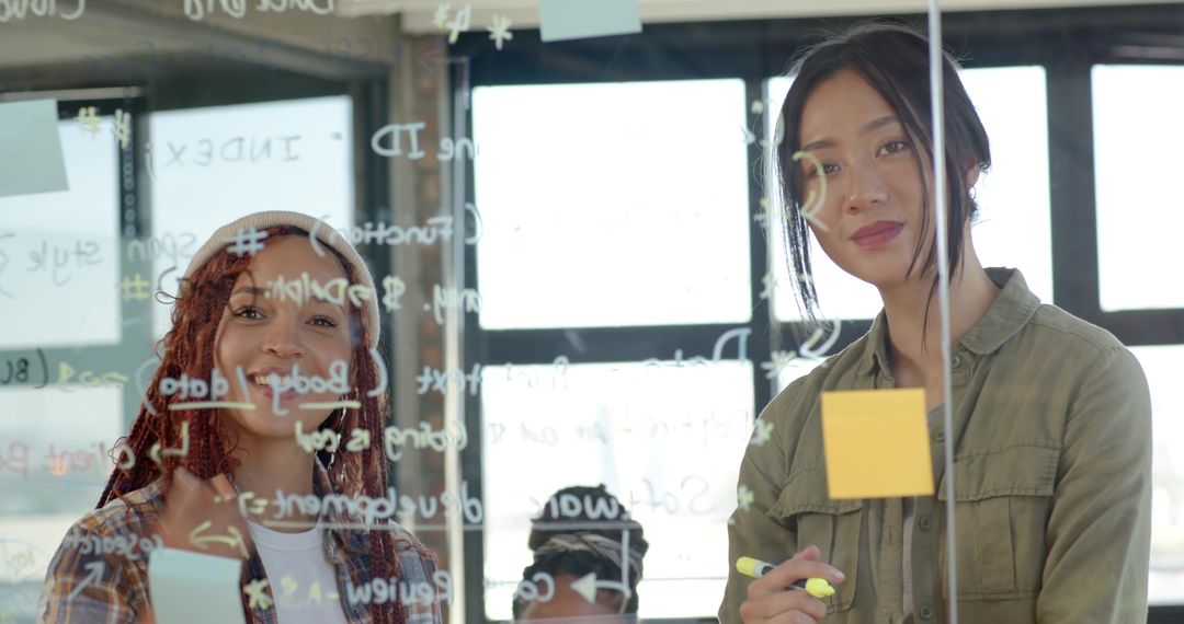 Diverse Female Colleagues Collaborative Office Brainstorming