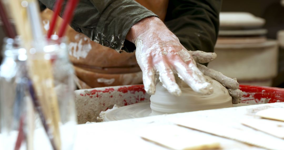 Artist Shaping Clay Pot on Pottery Wheel - Free Images, Stock Photos and Pictures on Pikwizard.com