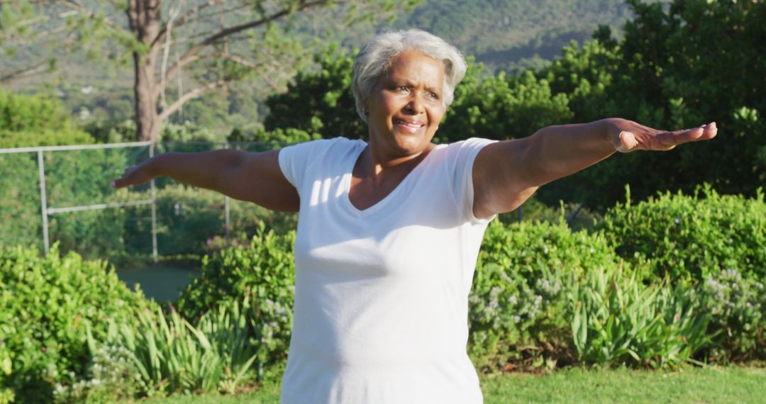 Senior Woman Exercising Outdoors in Garden - Free Images, Stock Photos and Pictures on Pikwizard.com