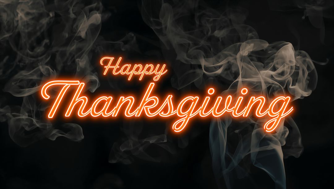 Neon Script Happy Thanksgiving Sign with Orange Glow and Smoky Haze on Dark Background