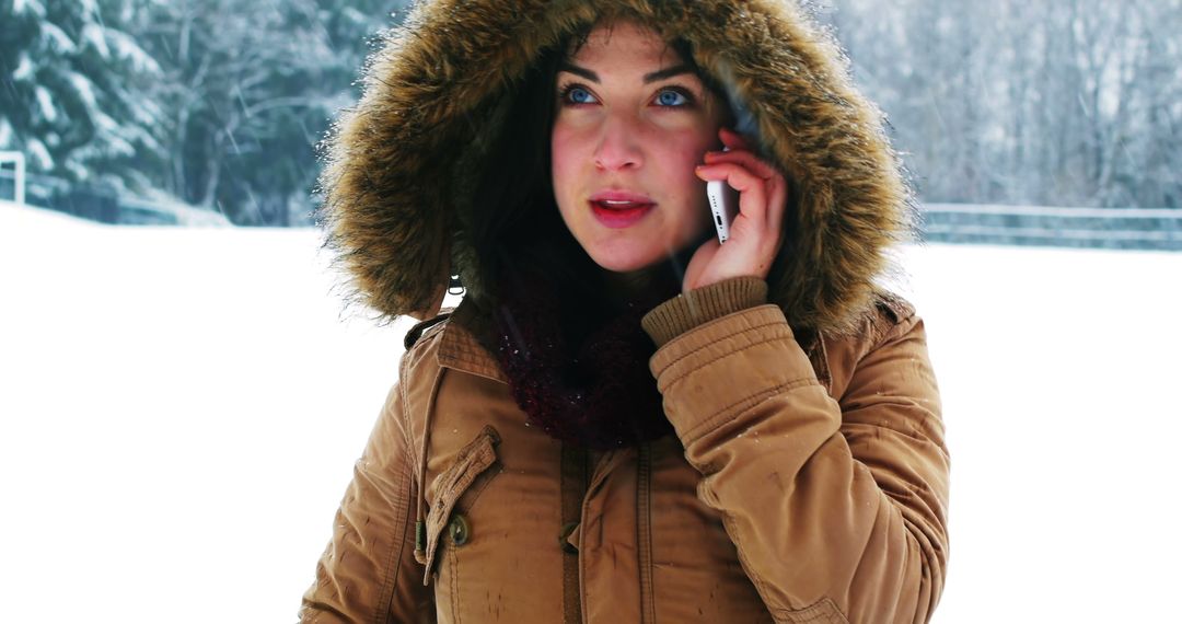 Woman Talking on Phone in Winter Clothing Outdoors - Free Images, Stock Photos and Pictures on Pikwizard.com