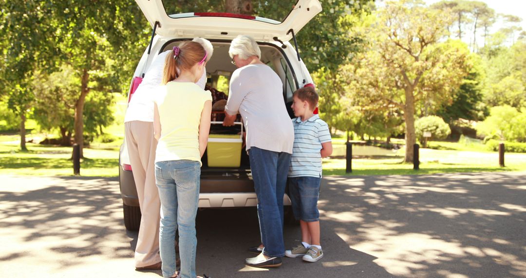 Family Packing Car Trunk for Outdoor Picnic in Park - Free Images, Stock Photos and Pictures on Pikwizard.com