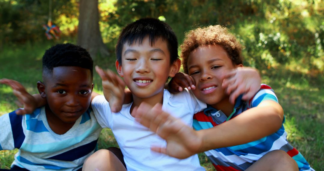 Diverse Boys Smiling and Hugging Outdoors in Park - Free Images, Stock Photos and Pictures on Pikwizard.com