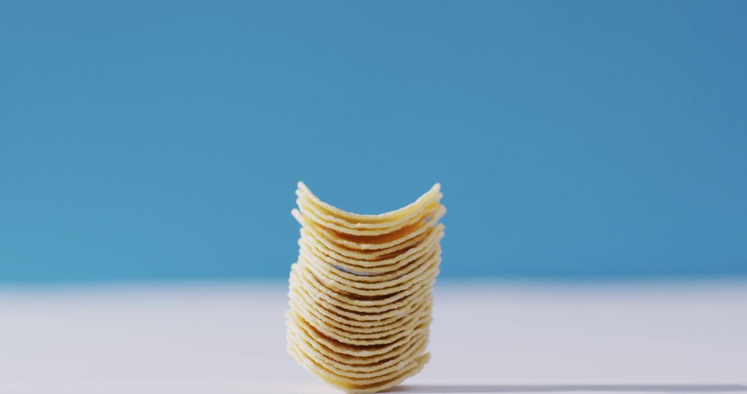 Stack of Potato Chips on Blue Background - Free Images, Stock Photos and Pictures on Pikwizard.com