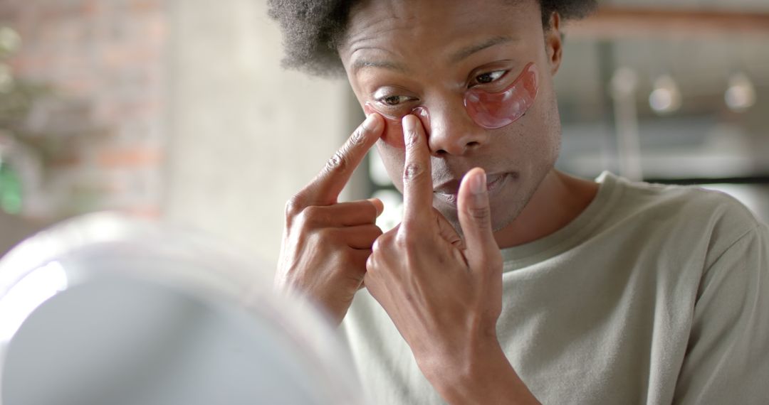 Man Applying Under-Eye Patches in Morning Routine - Free Images, Stock Photos and Pictures on Pikwizard.com