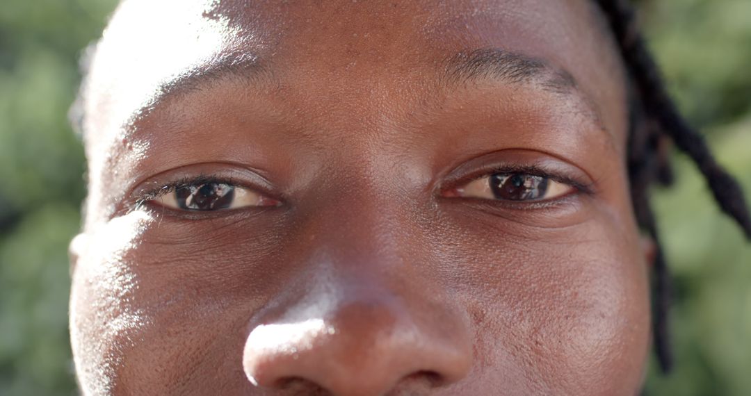 Close-up of African American man’s eyes outdoors emphasizing true emotion - Free Images, Stock Photos and Pictures on Pikwizard.com