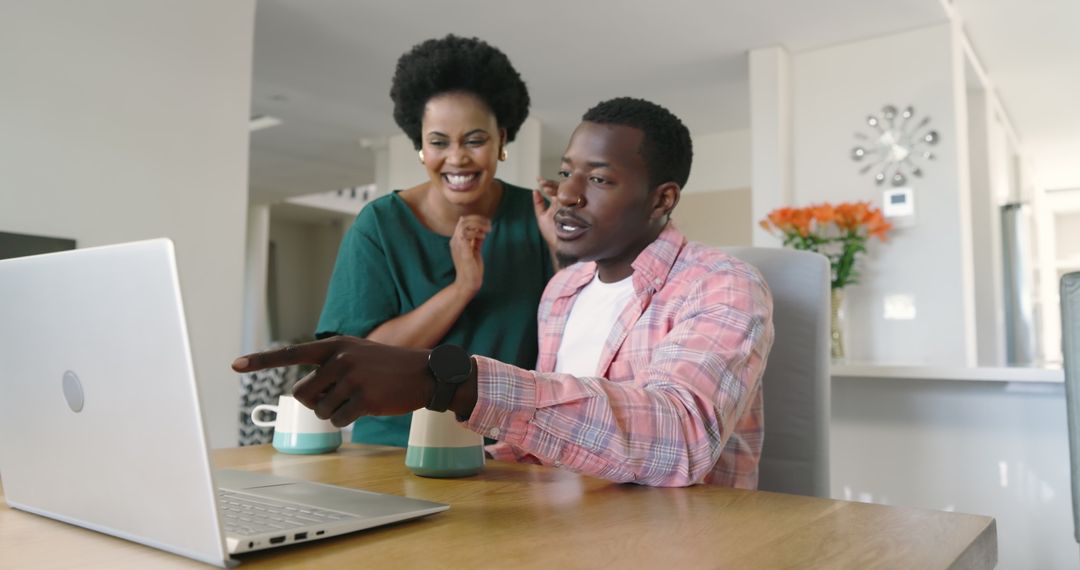 Happy Couple Bonding Over Coffee and Laughter at Home