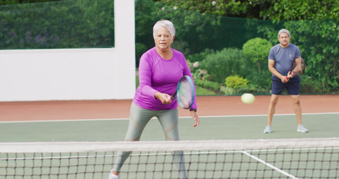 Active Senior Woman Playing Tennis - Free Images, Stock Photos and Pictures on Pikwizard.com