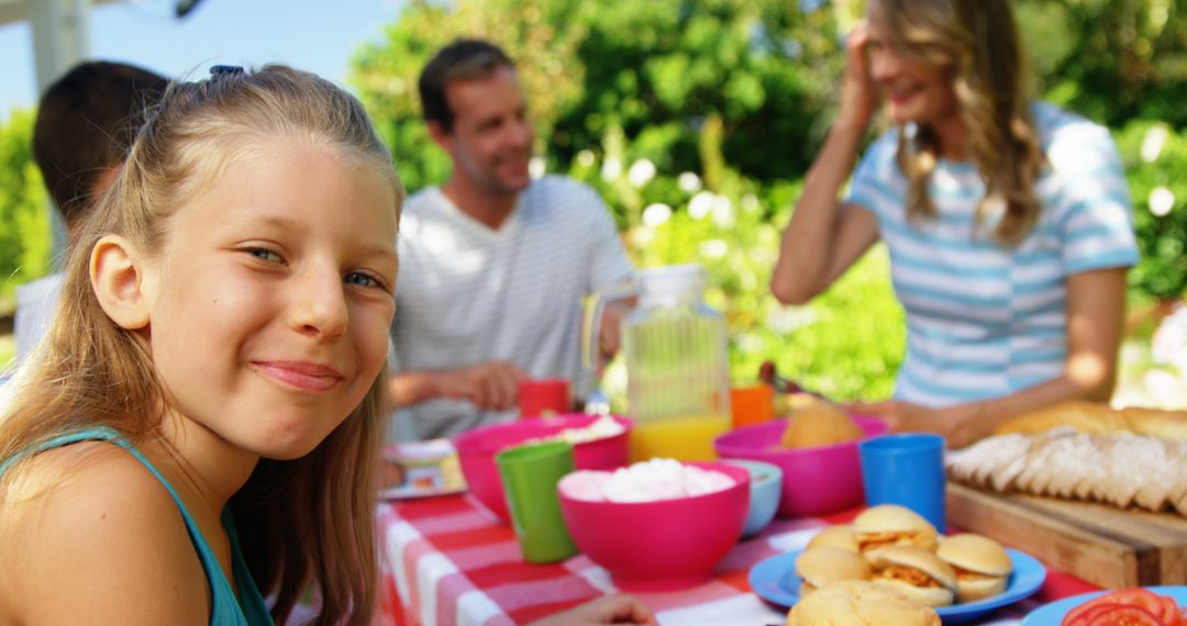 Happy Family Enjoying Outdoor Picnic in Sunny Backyard - Free Images, Stock Photos and Pictures on Pikwizard.com