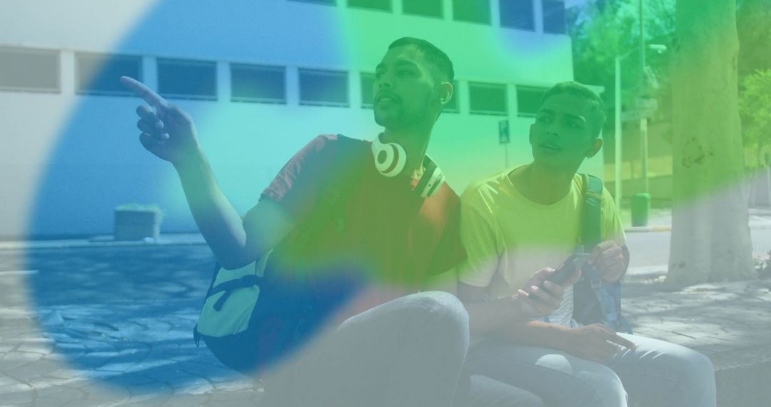 Casual Male Friends Using Technology in Urban Setting