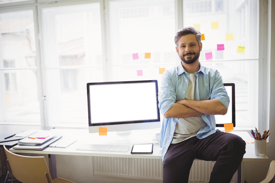 Confident Businessman in Transparent Office with Computers and Sticky Notes