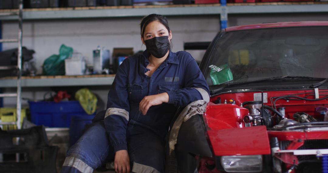 Female Mechanic Wearing Face Mask in Auto Workshop During Pandemic - Free Images, Stock Photos and Pictures on Pikwizard.com